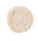 White Sand: circular pile of fine light beige powder with textured surface
