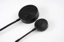 Black corded earbuds with circular matte finish on aquarium LED display stand