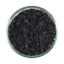 CaribSea Eco-Complete plant substrate with black coarse-grained aquarium gravel in a clear glass bowl