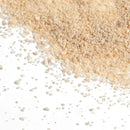 White Sand: beige granular texture with light and darker particles on white surface