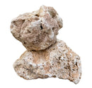 Hole stone textured beige and tan porous rock with rough uneven surface natural holes and crevices