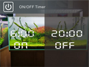 Ledstar AQ-X digital aquarium timer with sleek minimalist design showing 6:00 on 20:00 off in green planted tank