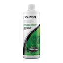 White plastic bottle with green leafy design and black stripe labeled flourish by Seachem for planted aquariums